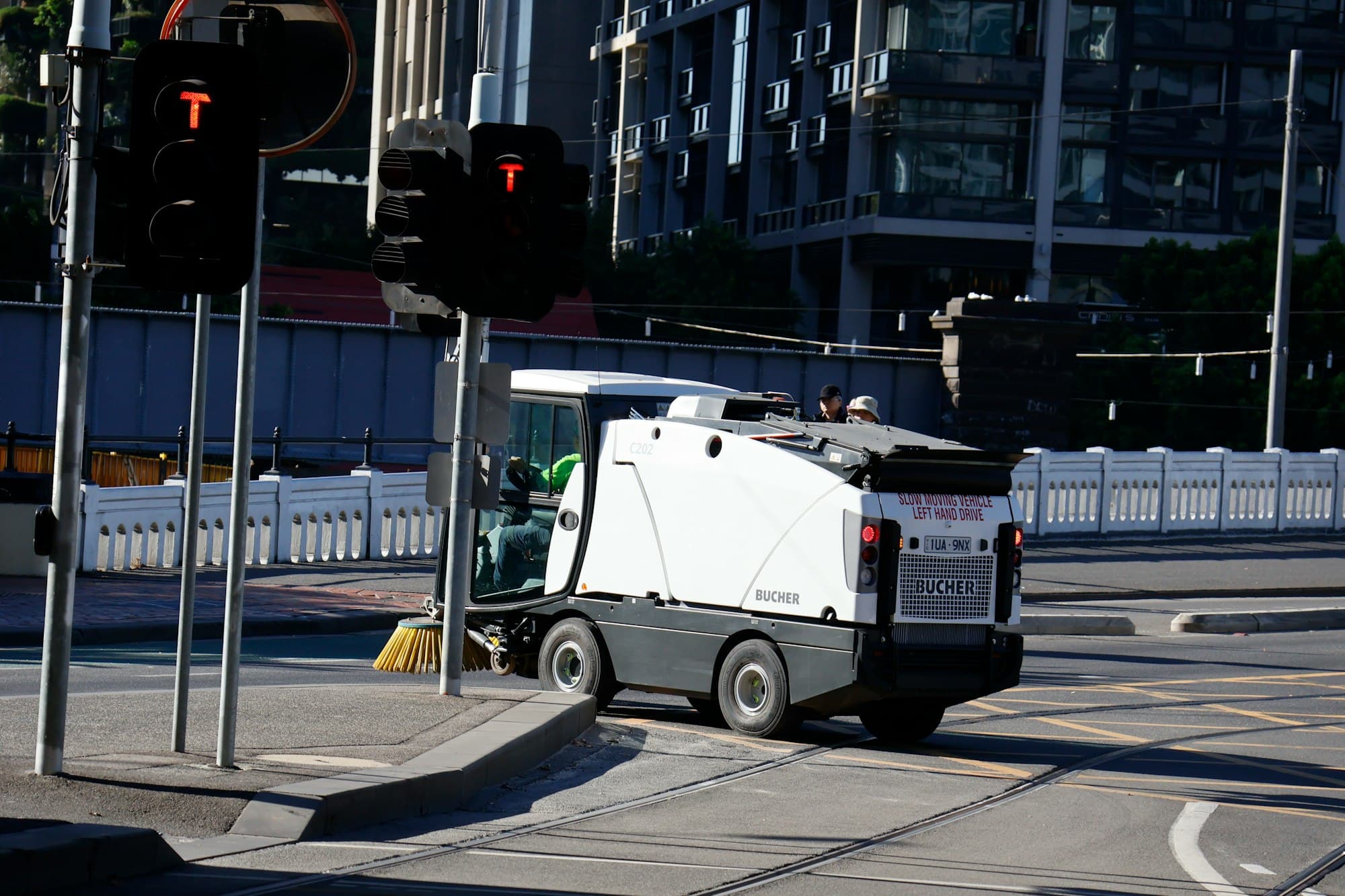 Street sweeper cleaning a city intersection
